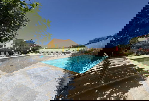 With a swimming pool and a playground for the kids.