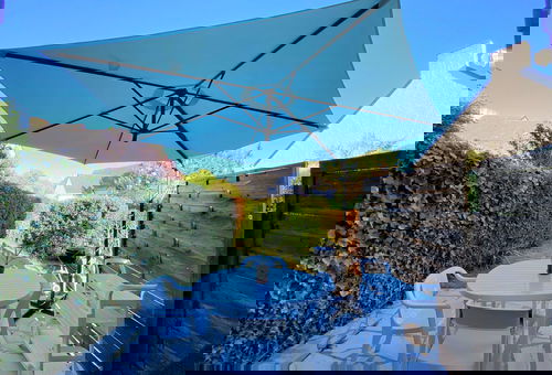 This small house is located in a holiday residence 100 m from the small port...