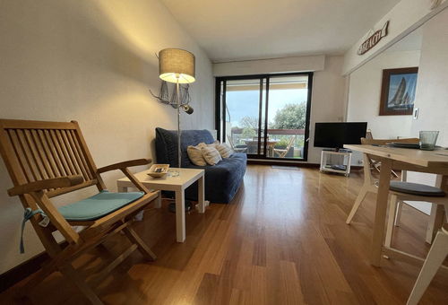View of the marina from the terrace of this apartment with a shared pool