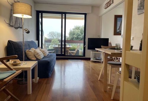 View of the marina from the terrace of this apartment with a shared pool