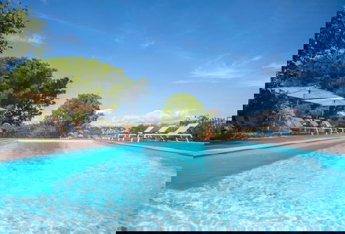 Villa in Calvi with warmed swimming pool, garden,  sea view near the beach.