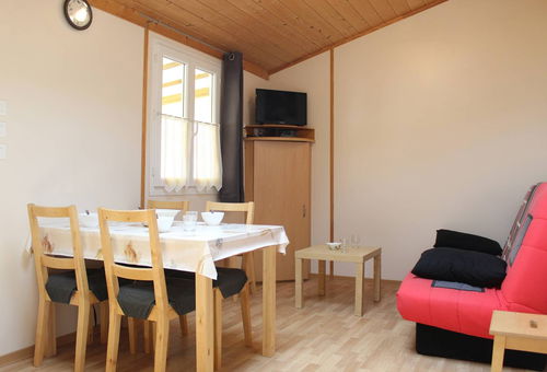 In a residential leisure park, charming wooden frame house