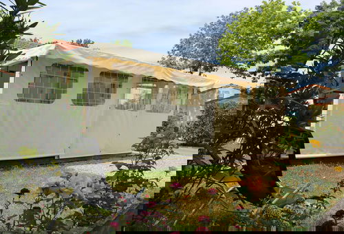 In a residential leisure park, charming wooden frame house