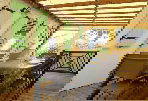 In a residential leisure park, charming wooden frame house