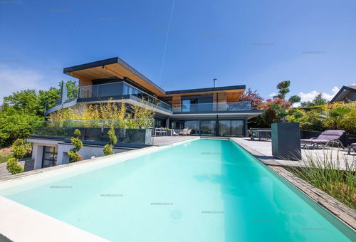 Beautiful contemporary villa with an infinity pool on the height of the lake...