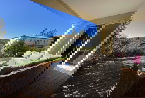 Air conditioning, parking, communal swimming pool.