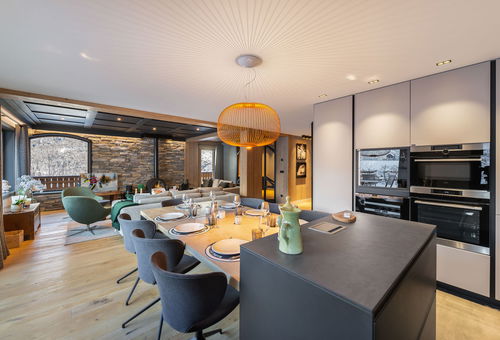 Next to the slopes and the shops.