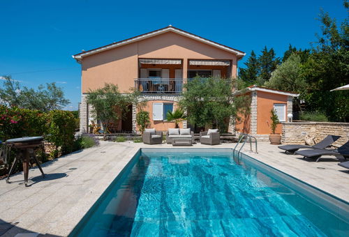 In a resort with swimming pool.