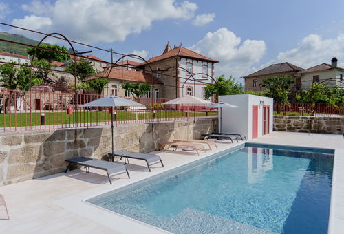 With private gardens and pool