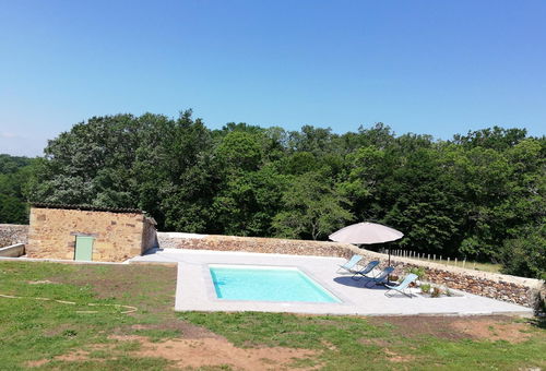 Surrounded by meadows and woods, this completely renovated stone house...