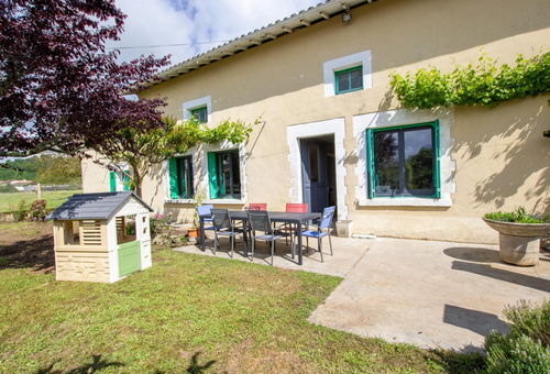 Country house with a small enclosed courtyard at the entrance and a garden at...