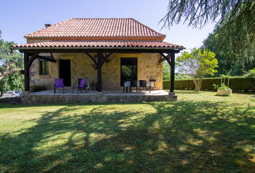 Quiet house surrounded by fields and meadows where sheep graze and...
