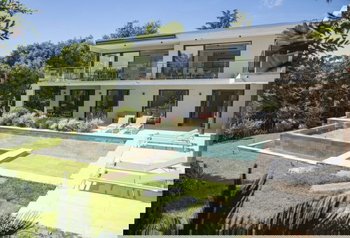 This stunning Californian-style villa welcomes you into a peaceful, lush...