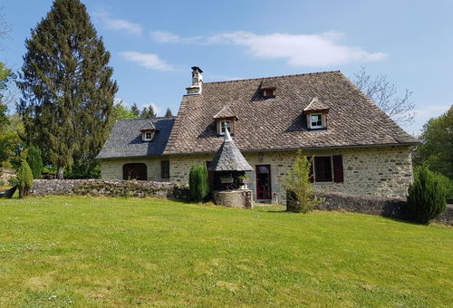 The house consists of a living room with a wood stove and television,...