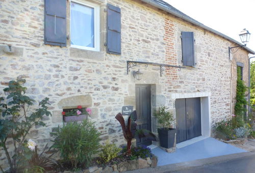 The house consists of a kitchen open to a living/dining room,...