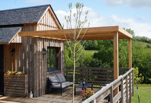 The tiny house consists of a mezzanine bedroom, a bathroom and a...