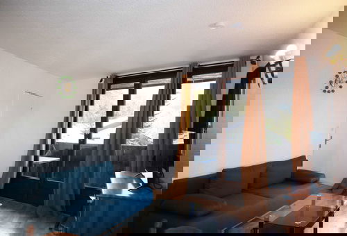At the foot of the slopes, south-facing balcony.