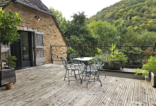 Stone cottage with slate roof, including a large terrace...