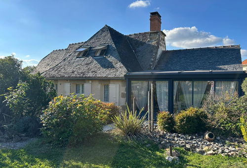 On the ground floor, a large, bright living room with a fully equipped...